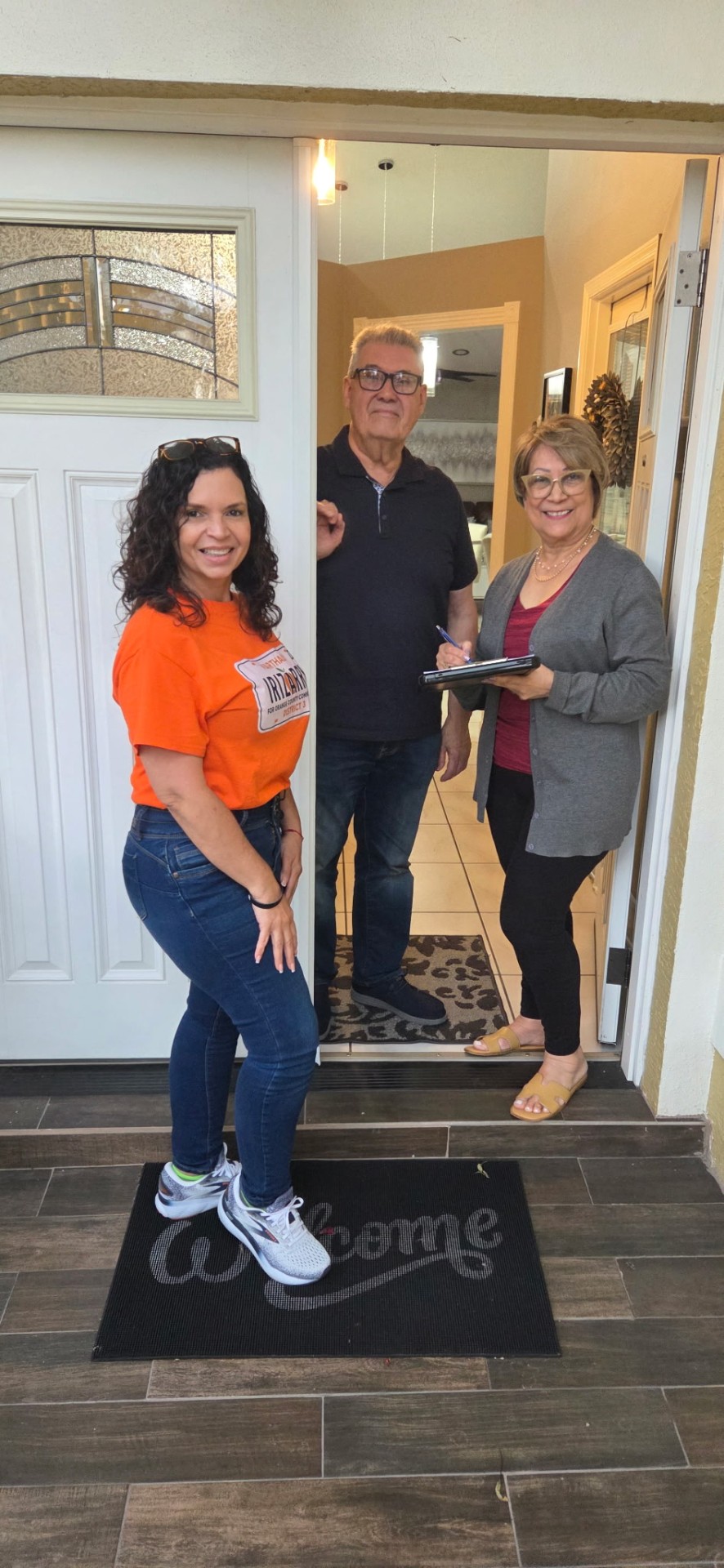Marthaly canvassing with neighbors at their door
